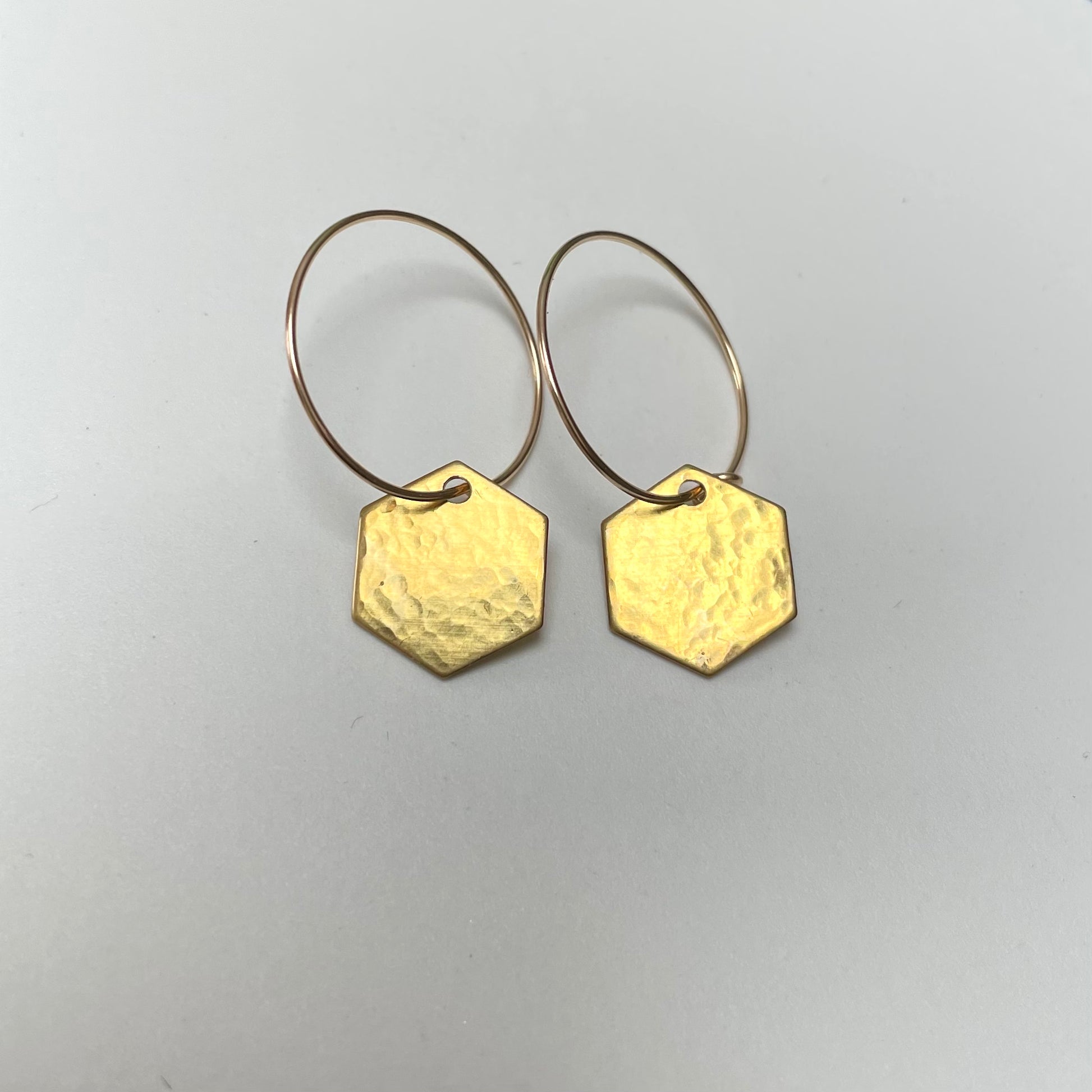 Hammered brass hexagon earrings on gold filled hoops 