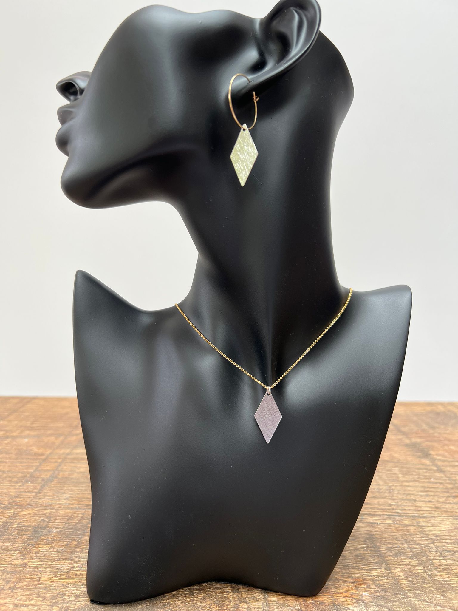 Brushed diamond earring and necklace gift set on bust