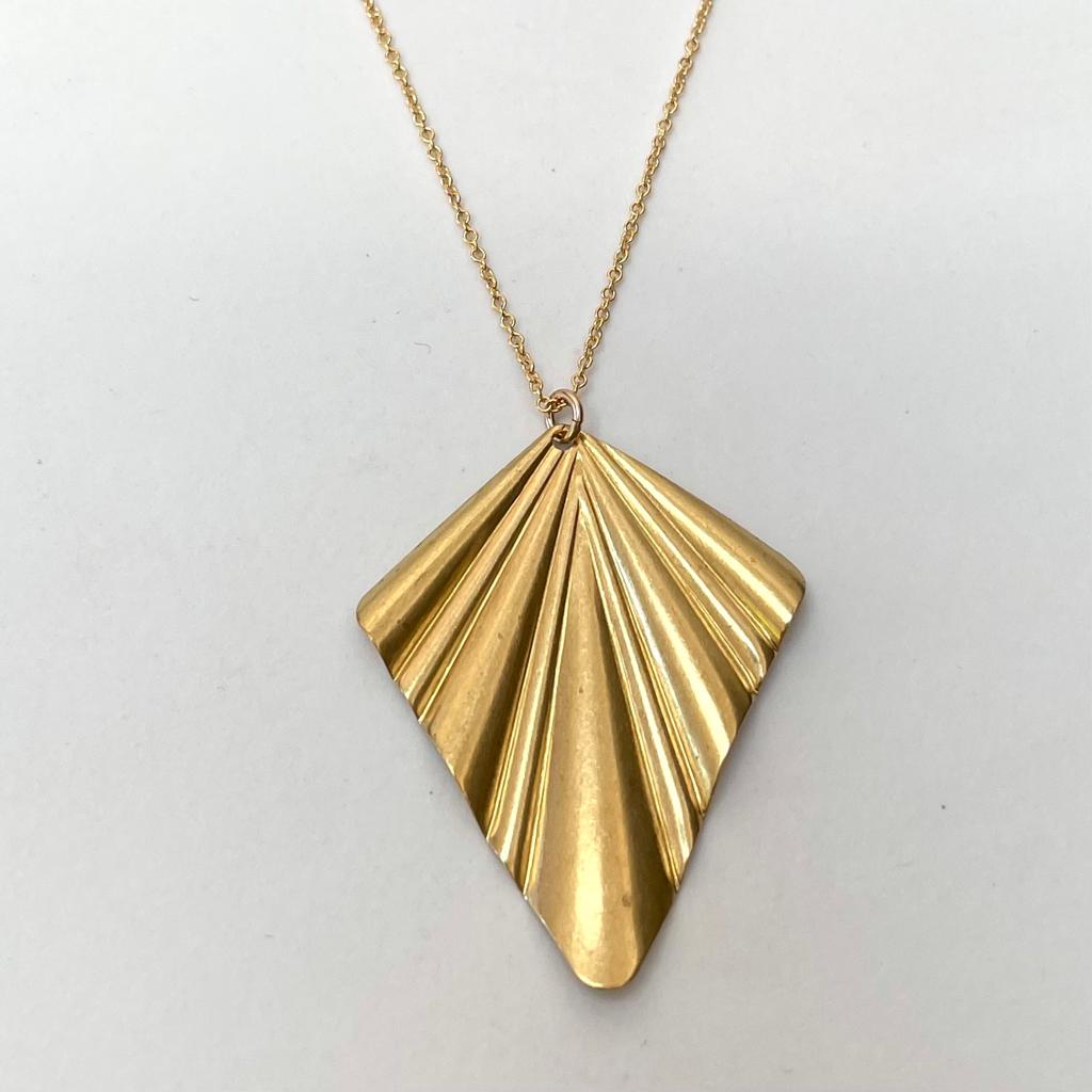 Large brass fan on a gold filled chain 