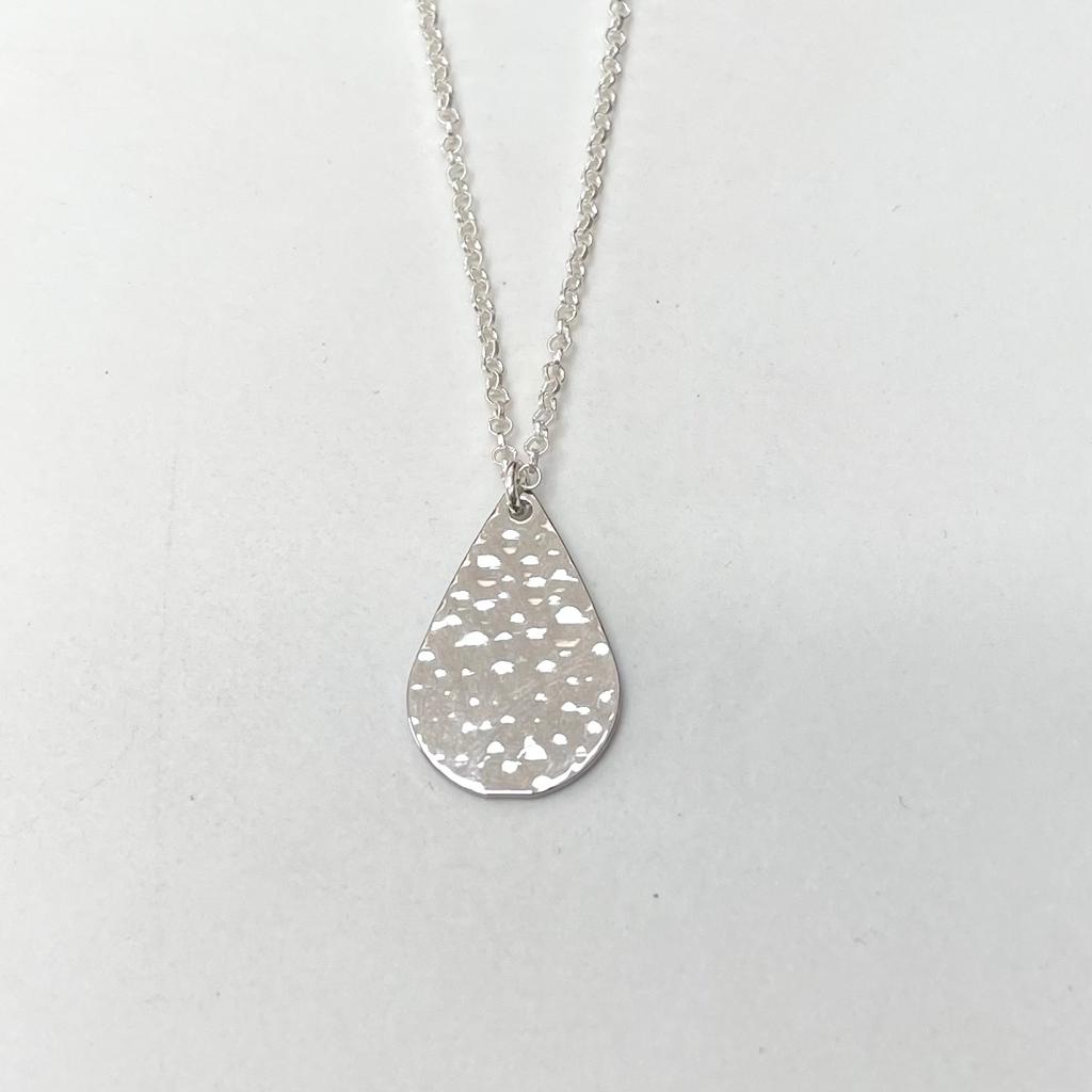 Dimpled petal shape charm on a sterling silver chain